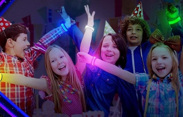 Children wearing FANL LED glow bracelets at a birthday party after dark